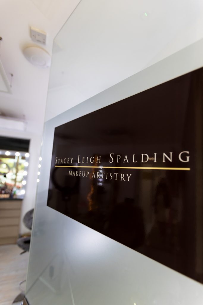 Stacey Leigh Spalding Makeup artist & brow specialist in Falkirk logo on her glass door in shop.